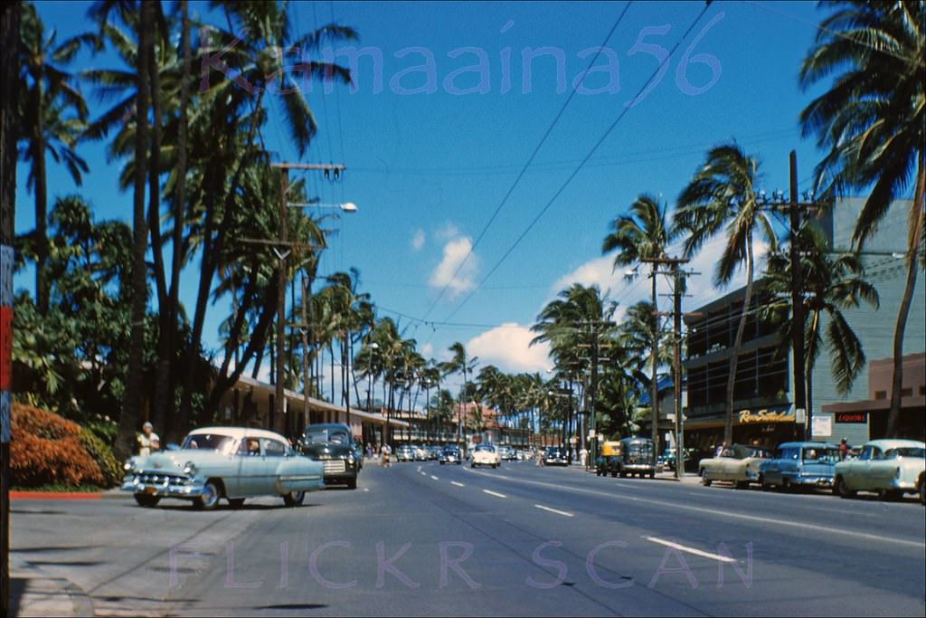 Looking west along Waikiki’s Kalakaua Avenue from around the Royal Hawaiian Hotel driveway, 1950s