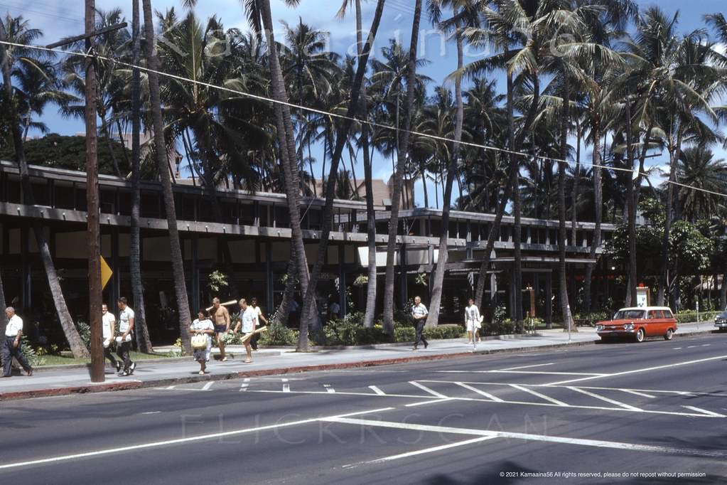 The Royal Hawaiian Shopping Arcade on Kalakaua Avenue across from Liberty House department store and the Waikiki Theater, 1962