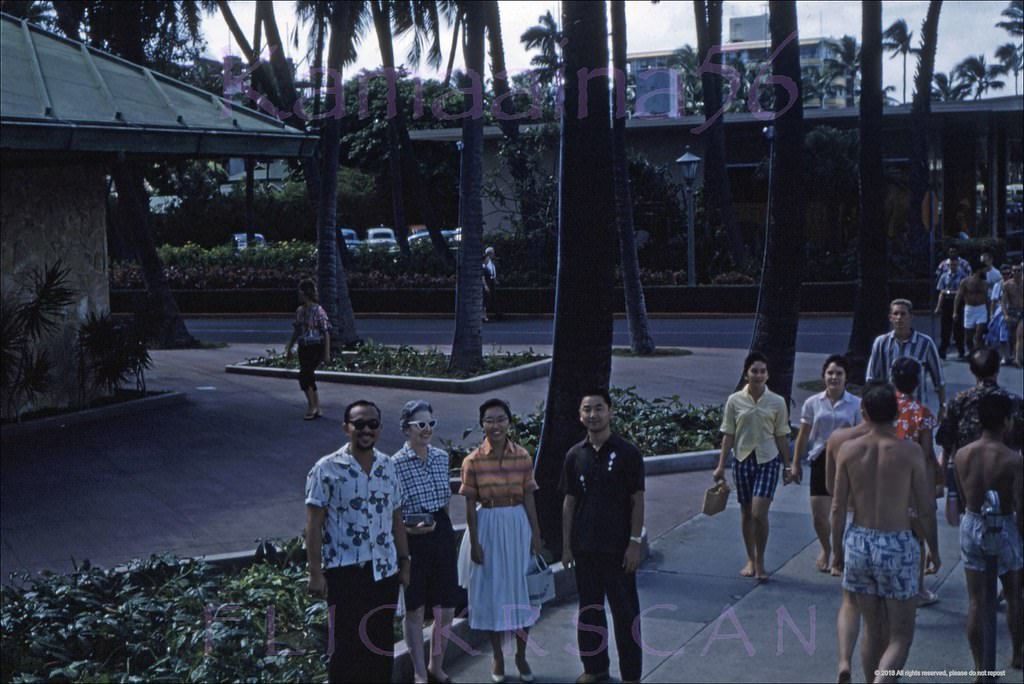 Unusual angle on Waikiki’s Kalakaua Avenue seen from a statehood parade grandstand on the corner with Seaside Avenue, 1959