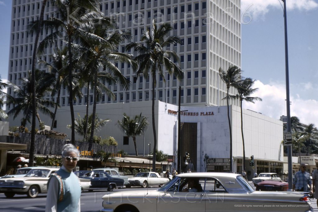Waikiki’s busy Kalakaua Avenue viewed from the original driveway at the Royal Hawaiian Hotel, 1965.
