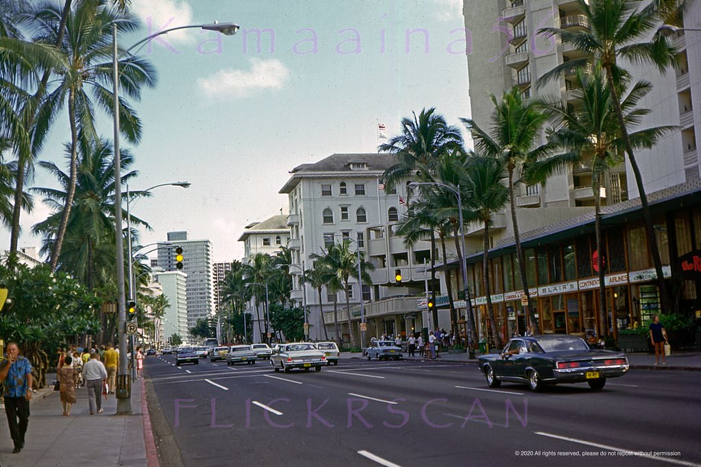 East along Waikiki’s Kalakaua Avenue shortly after its conversion to one way Diamond Head with no more on-street parking, 1971