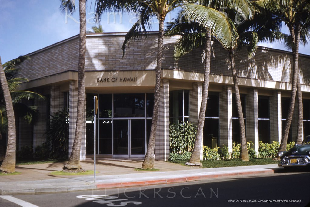 The Bank of Hawaii Waikiki branch on the corner of Kalakaua and Royal Hawaiian Avenues viewed from in front of the Waikiki Medical building across Royal Hawaiian, 1952