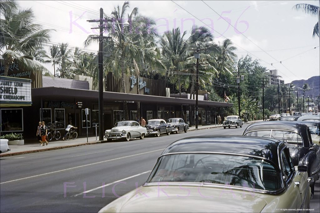 Looking Diamond Head at the Mauka side of Kalakaua Avenue across the street from the Royal Hawaiian Hotel (out of frame at right), 1954