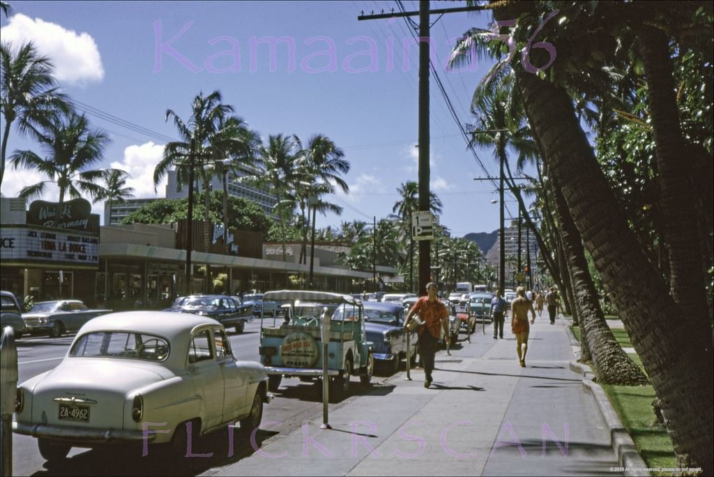Morning view along Waikiki’s Kalakaua Avenue looking Diamond Head from the Royal Hawaiian Hotel's street front gardens, 1963