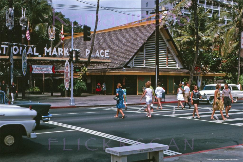 Waikiki’s Kalakaua Avenue seen from the Outrigger Arcade between the Royal Hawaiian and Moana Hotels, 1963