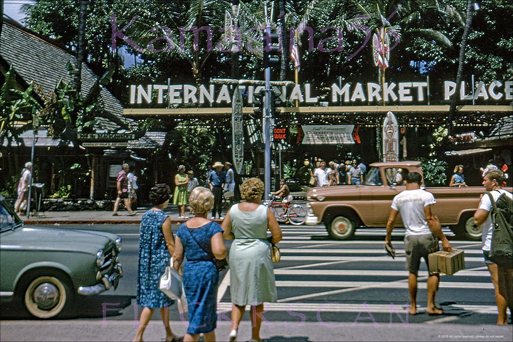 Waikiki’s busy Kalakaua Avenue looking inland at the International Market Place, 1960s