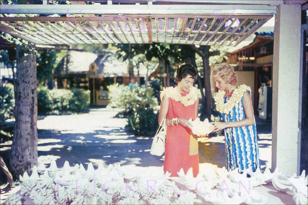 Tourist shopping at a remarkably uncrowded International Market Place in Waikiki, 1959