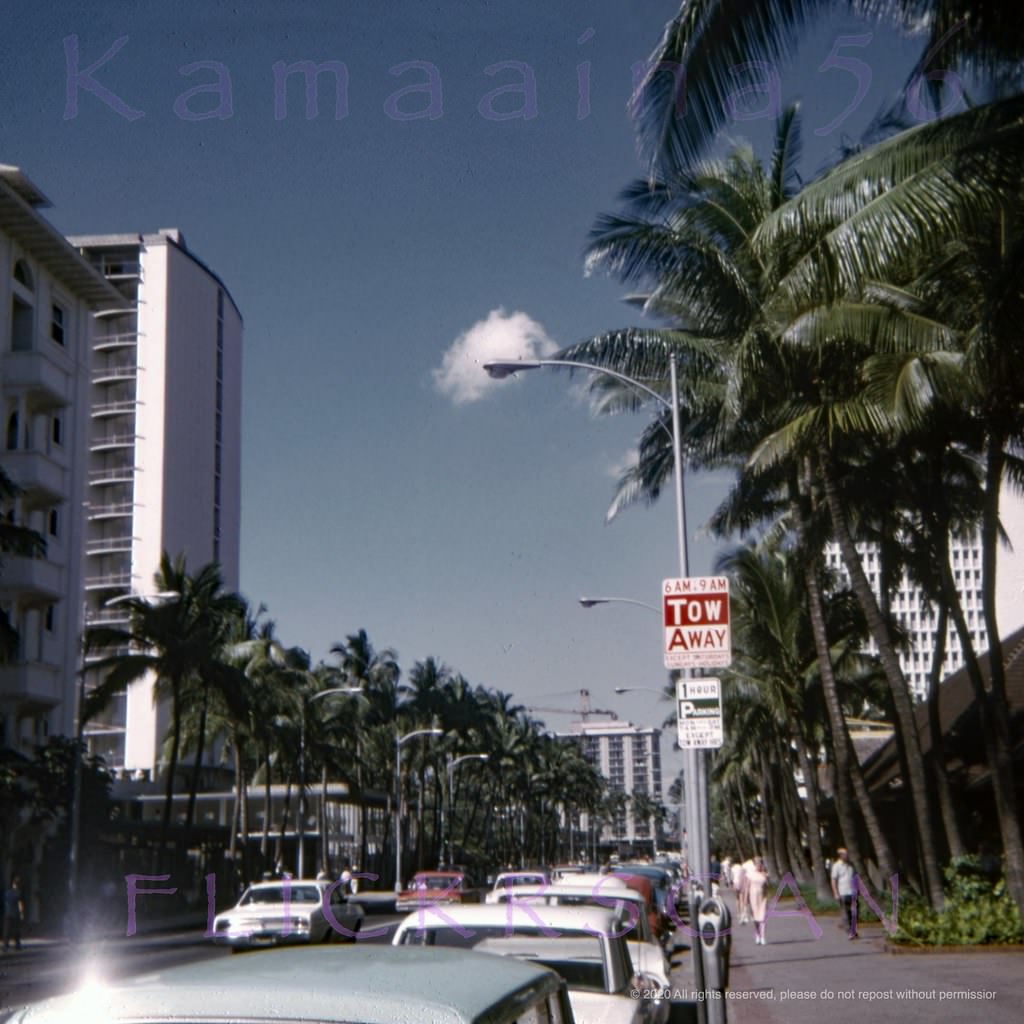 New towers on Waikiki’s Kalakaua Avenue in this view looking Ewa (more or less west here) from the street front shops at the Princess Kaiulani Hotel, 1967