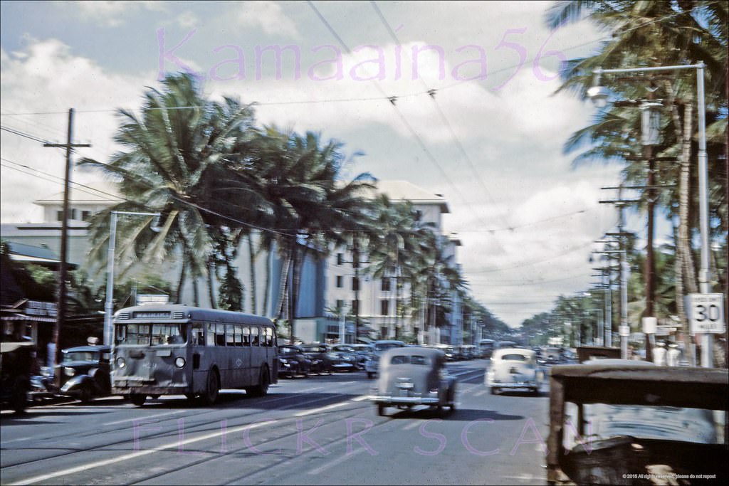 Old Waikiki, looking west along Kalakaua Avenue from east of the Kaiulani Avenue intersection, 1945