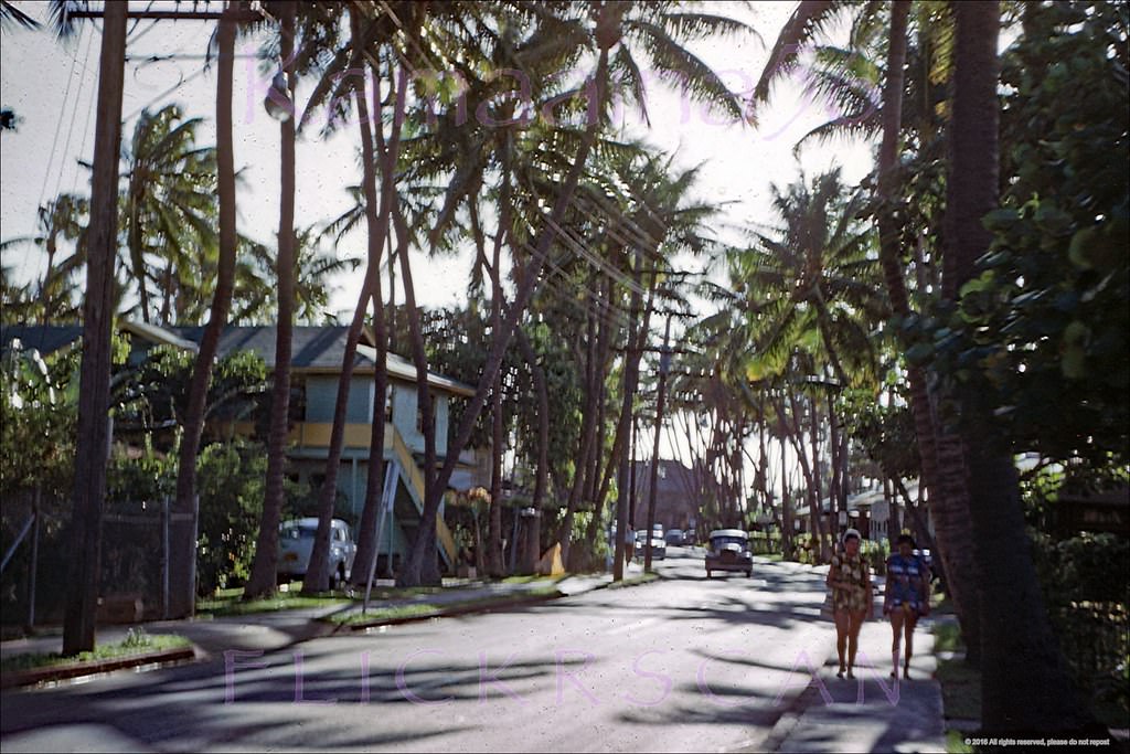 Slightly blurry but still interesting view looking towards the ocean along Waikiki’s Lewers Street, 1952