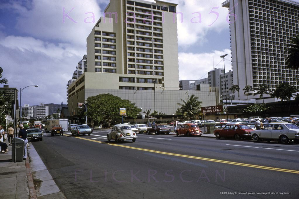 Looking Diamond Head (east) along Waikiki’s Kuhio Avenue between Kaiulani Avenue (left) and Duke’s Lane (out of frame at right), 1973