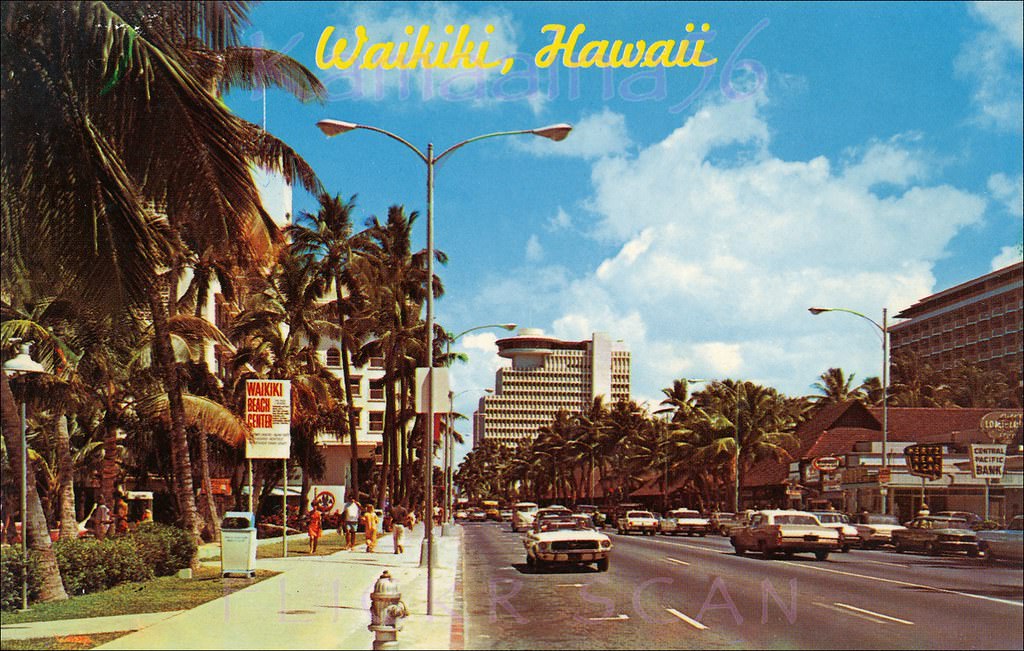 Looking ewa along Kalakaua Avenue in Waikiki from in front of the Surfrider Hotel just diamond head of Kaiulani Avenue, 1967