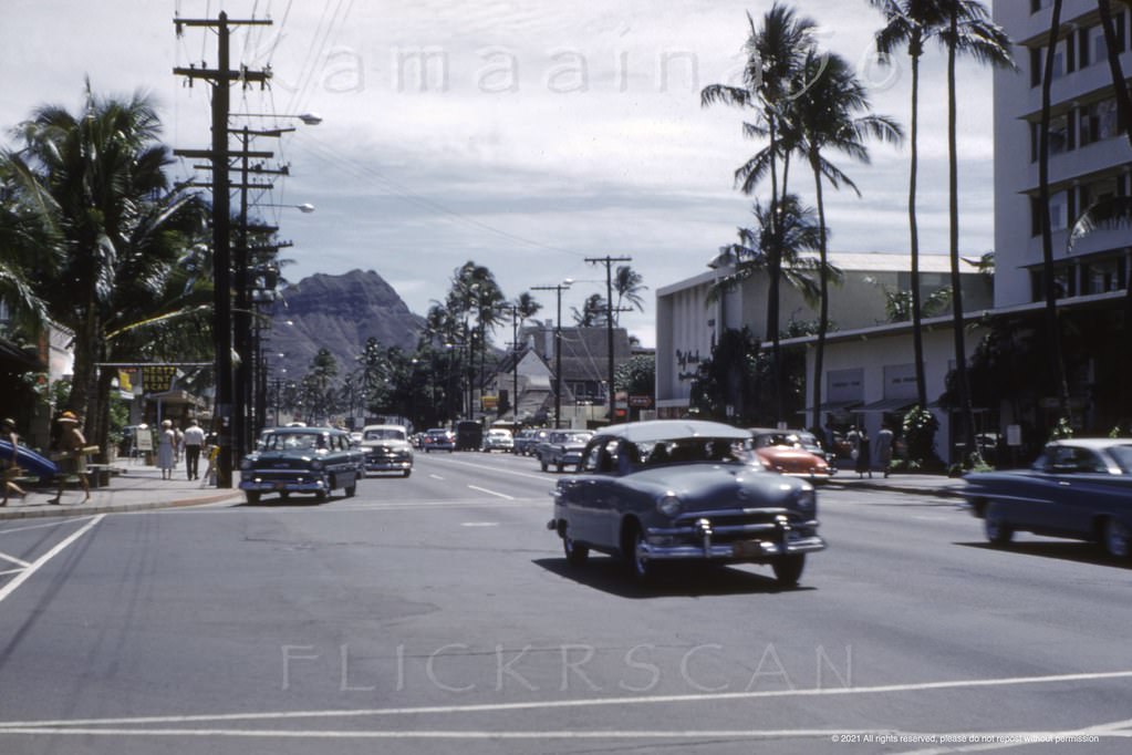 Diamond Head view along Waikiki’s Kalakaua Avenue from the intersection with Kaiulani Avenue, 1959