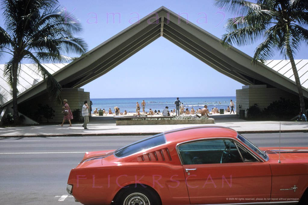 The Waikiki Beach Center Arch viewed from across Kalakaua Avenue, 1960s