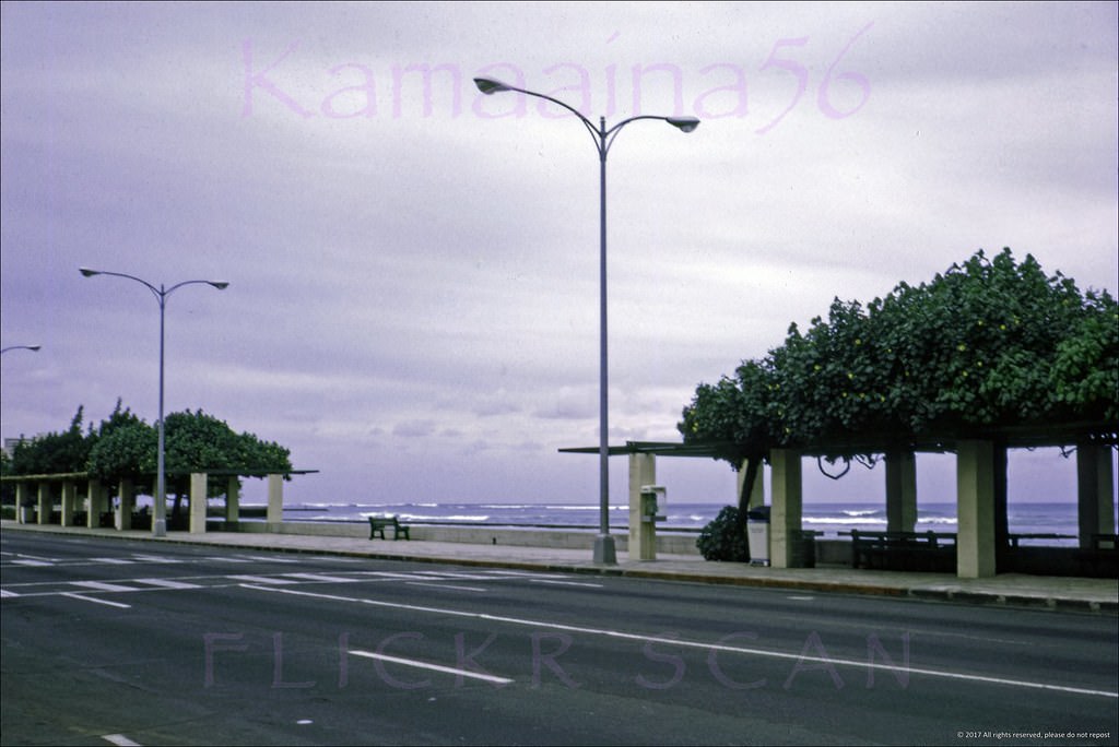 Early morning looking more or less east along Waikiki’s Kalakaua Avenue near the intersection with Kealohilani Avenue, 1967