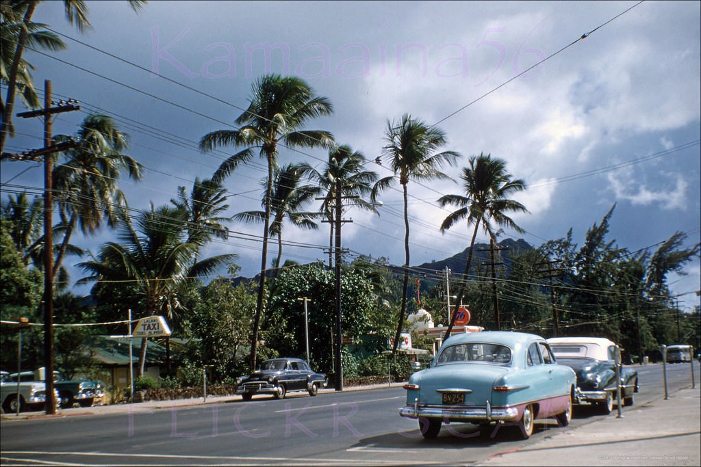 Looking Diamond Head from the makai sidewalk of Waikiki’s Kalakaua Avenue at Paoakalani, 1960s