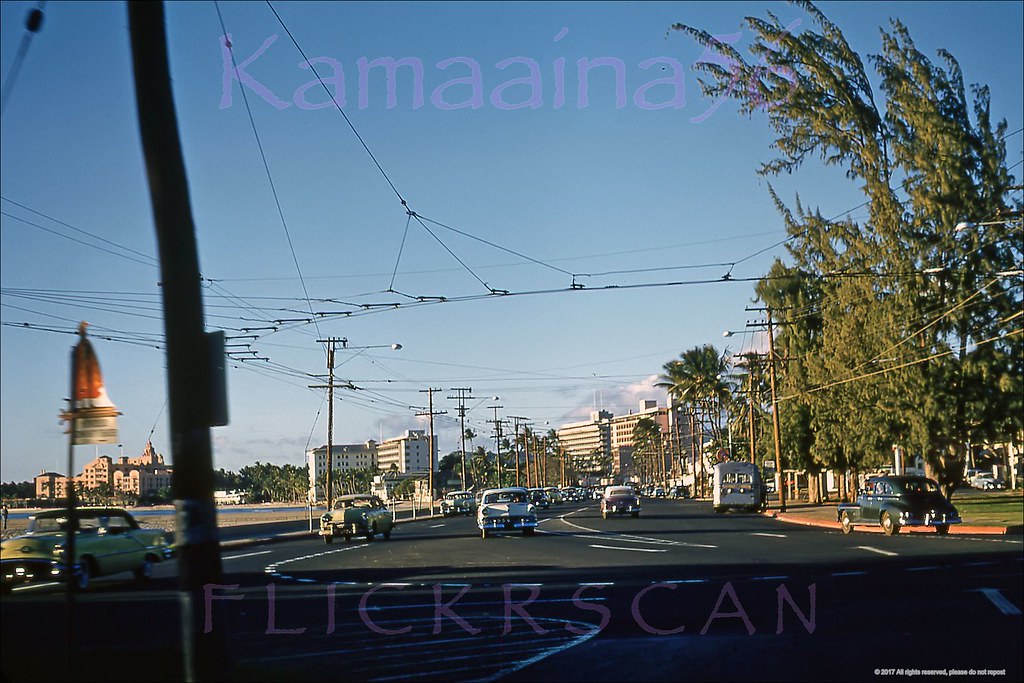 Late afternoon ewa view along Waikiki’s Kalakaua Avenue at the Monserrat Avenue intersection, 1956