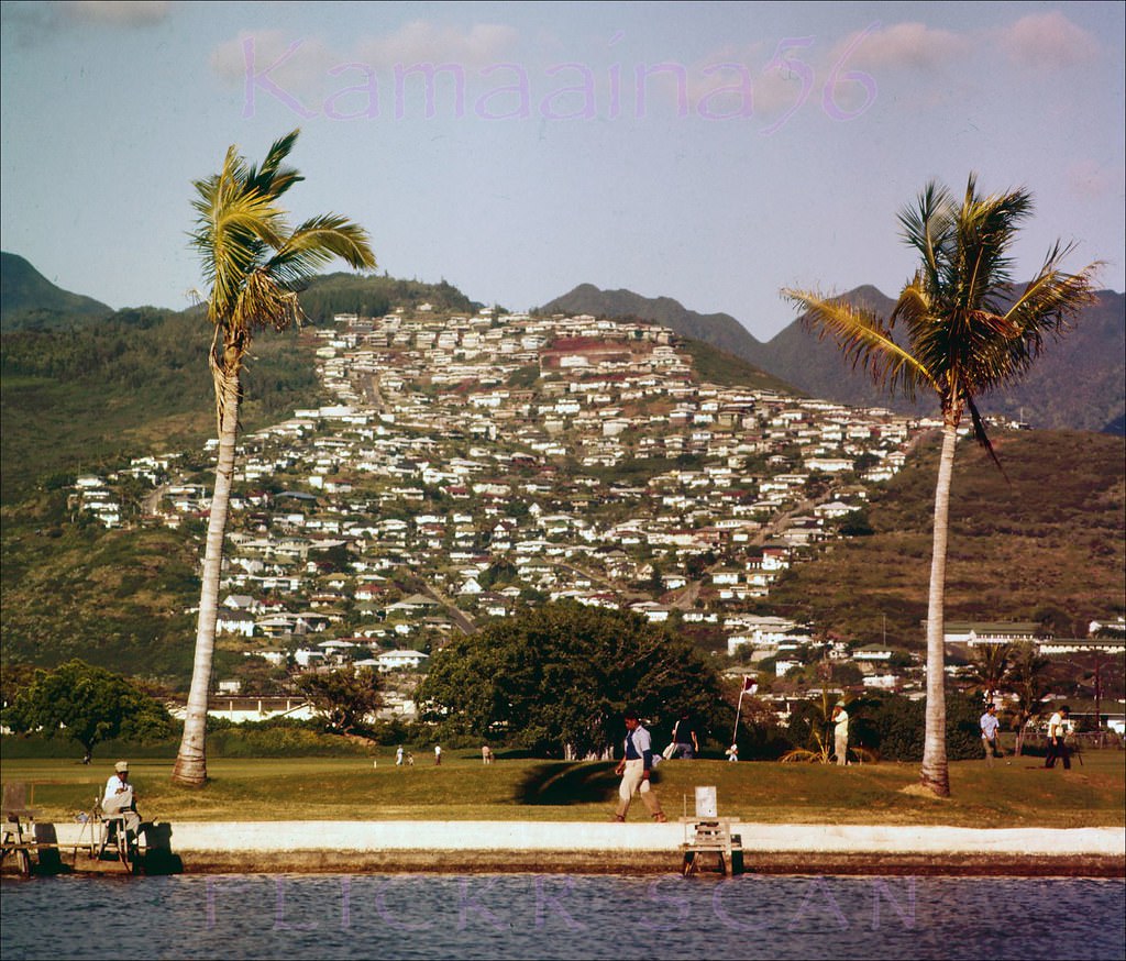 St. Louis Heights nicely framed by palm trees at Ala Wai Golf Course, 1957.