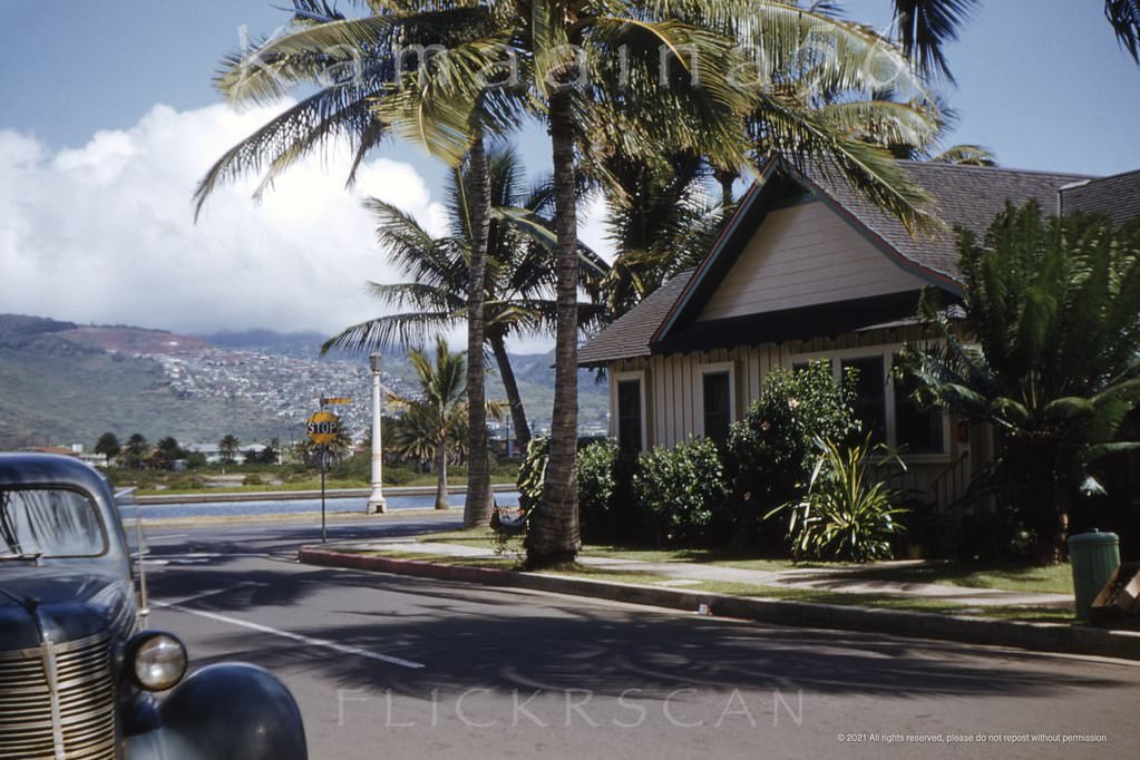 The street sign above the stop sign unfortunately can’t be read but this appears to be the corner of Ala Wai Blvd and Lewers Street, 1952