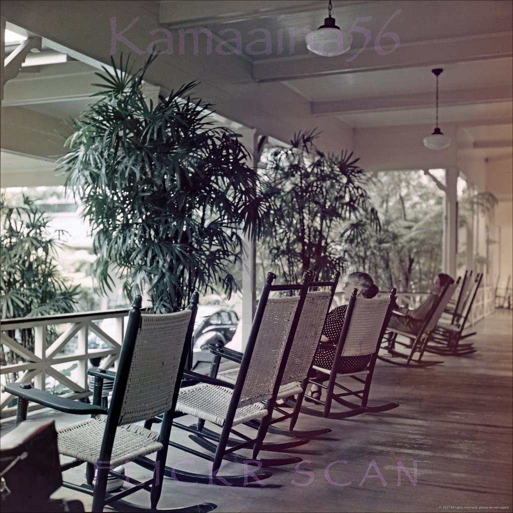 Old rocking chairs line the front porch of the Moana Hotel looking out on Waikiki’s Kalakaua Avenue, 1950s