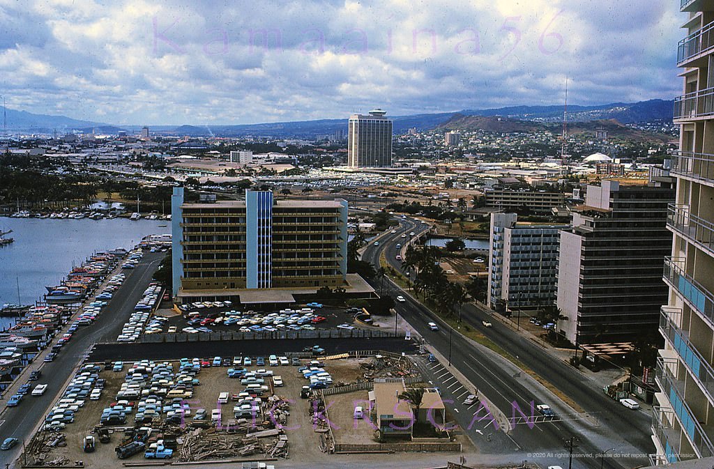 Looking west towards Ala Wai Harbor and Honolulu along Ala Moana Blvd from the 26-story Ilikai Hotel, 1964