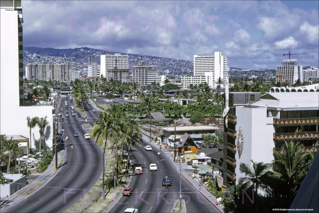 Sharp aerial view from a blacony on the sixth floor at the Ilikai Hotel looking mauka (inland) along Waikiki’s stretch of Ala Moana Blvd., 1970