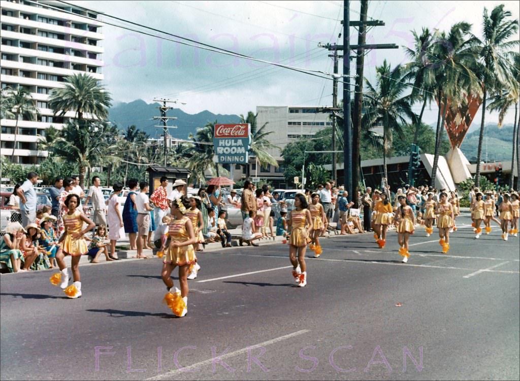 Parade on Ala Moana Blvd. at John Ena Road with Tops Coffee Shop in the background, 1960s