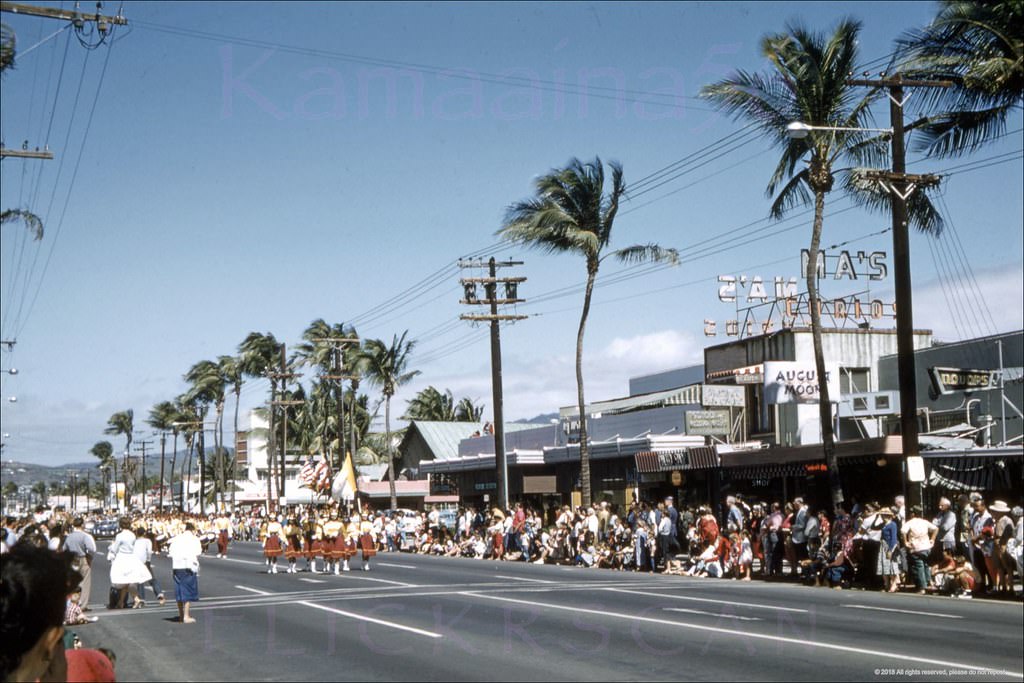 Parade along Waikiki’s Kalakaua Avenue looking Ewa (more or less northwest here) from the Beachwalk intersection, 1960
