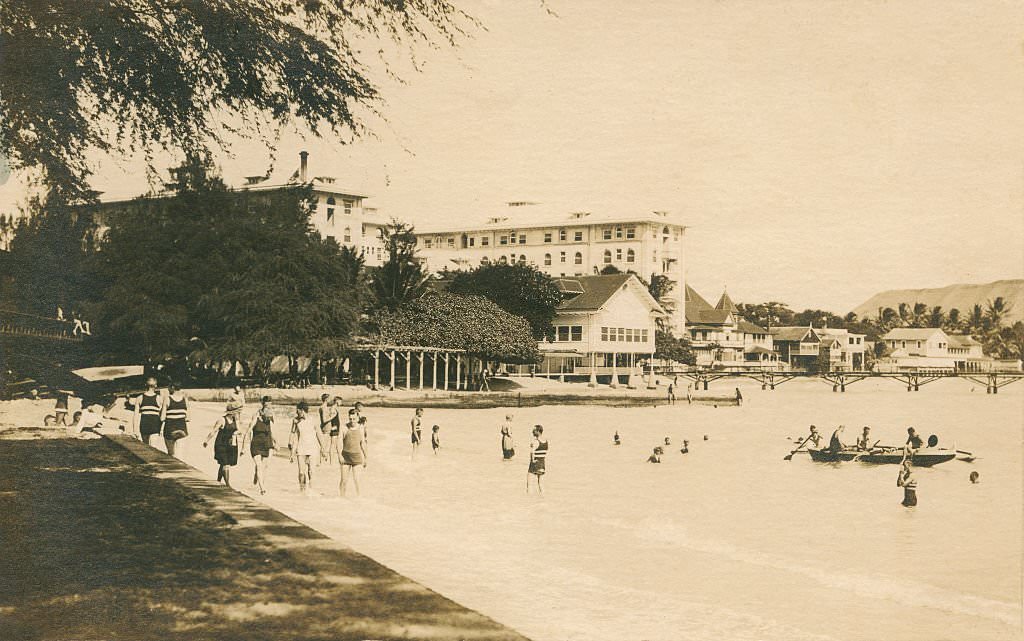 Wide shot of people bathing in water, 1940s