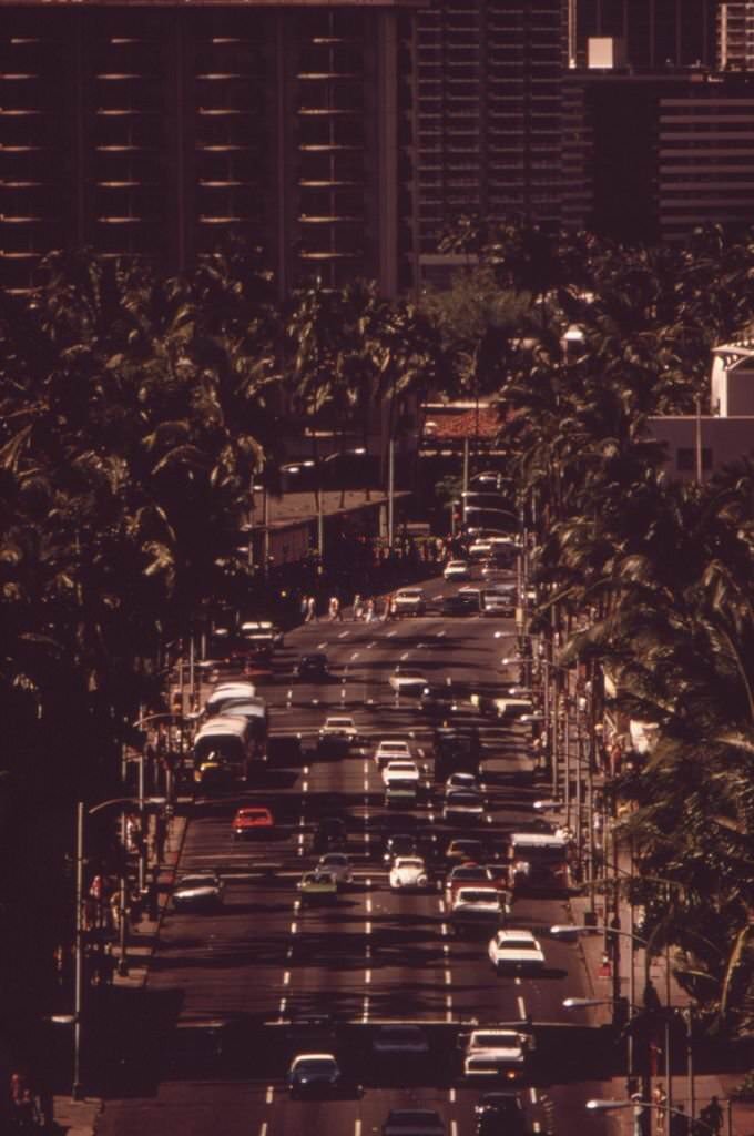 View of traffic down Kalakaua Avenue, the main street of the Waikiki Beach area, 1973
