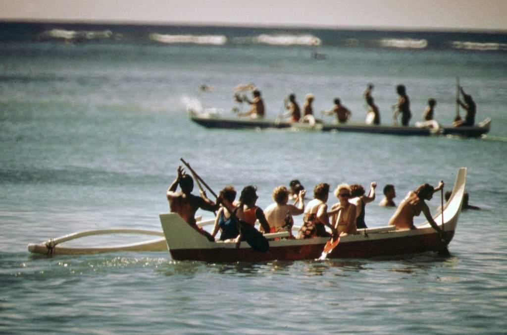 Waikiki Beach visitors enjoy the outrigger canoe, October 1973