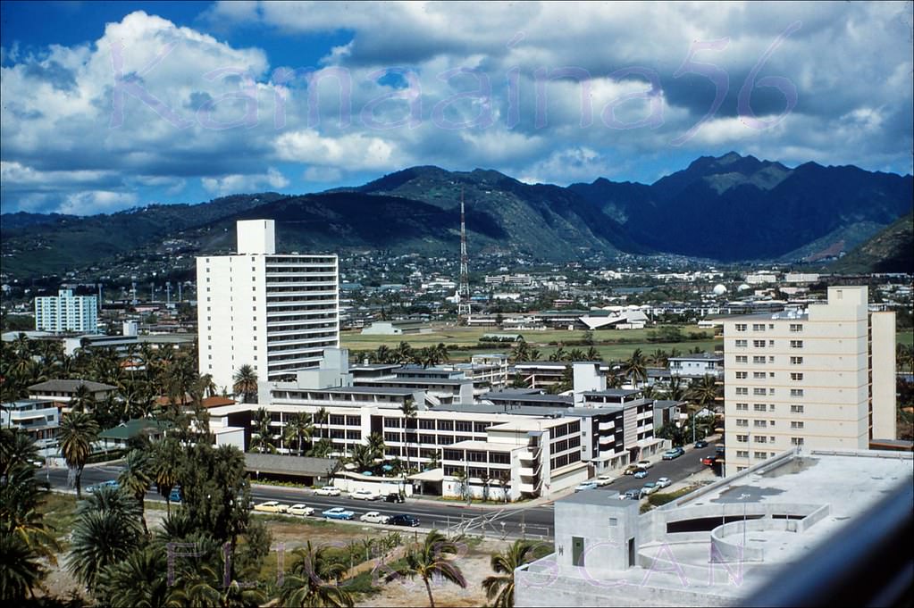 Inland view of Kuhio Avenue and beyond from an upper floor at the Diamond Head Wing of the Princess Kaiulani Hotel, 1962