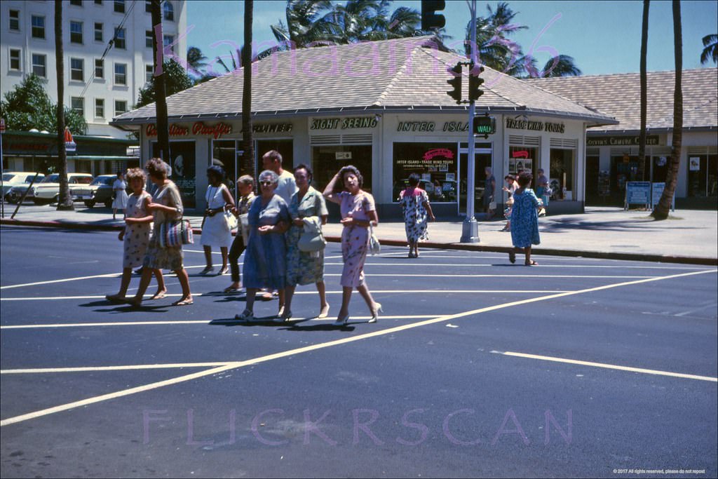 Street level shot taken from the crosswalk at the International Market Place looking makai across Kalakaua Avenue, 1962