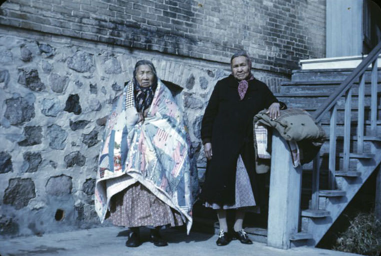 Alice Bigthunder and Annie Henzley with quilts, Bethany Indian Mission, Wittenberg, Wisconsin, 1953