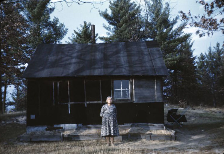 Nellie Wolf by house, Bethany Indian Mission, Wittenberg, Wisconsin, 1953