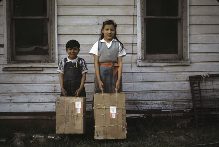 Tony and Martha Whitewing with packages, Bethany Indian Mission, Wittenberg, Wisconsin, 1953