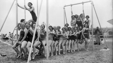 People Enjoying at France's glamorous Deauville beach from the early 20th Century