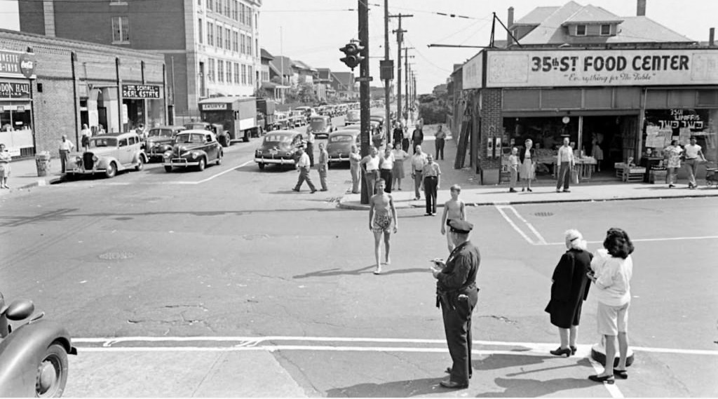 People being ticketed indecent Exposure Rockaway Beach 1946