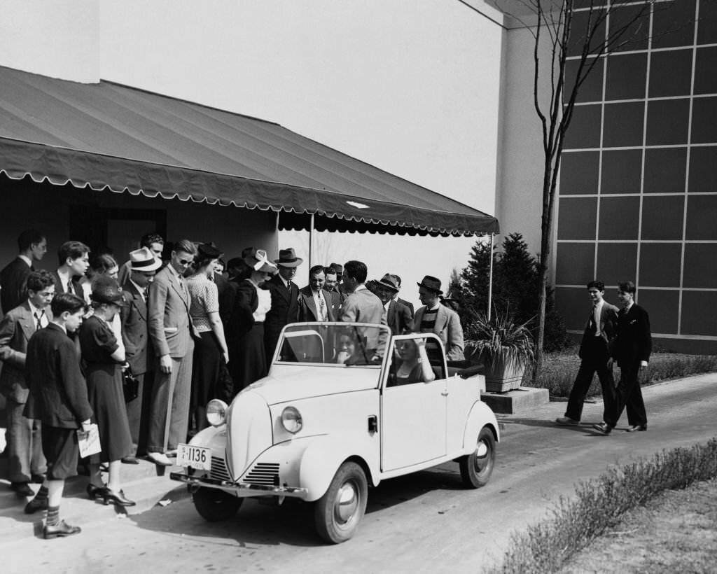 The four-person Crosley small car at the 1939 New York World's Fair.. It has two cylinders, goes 50 miles on a gallon of gas and costs $350.