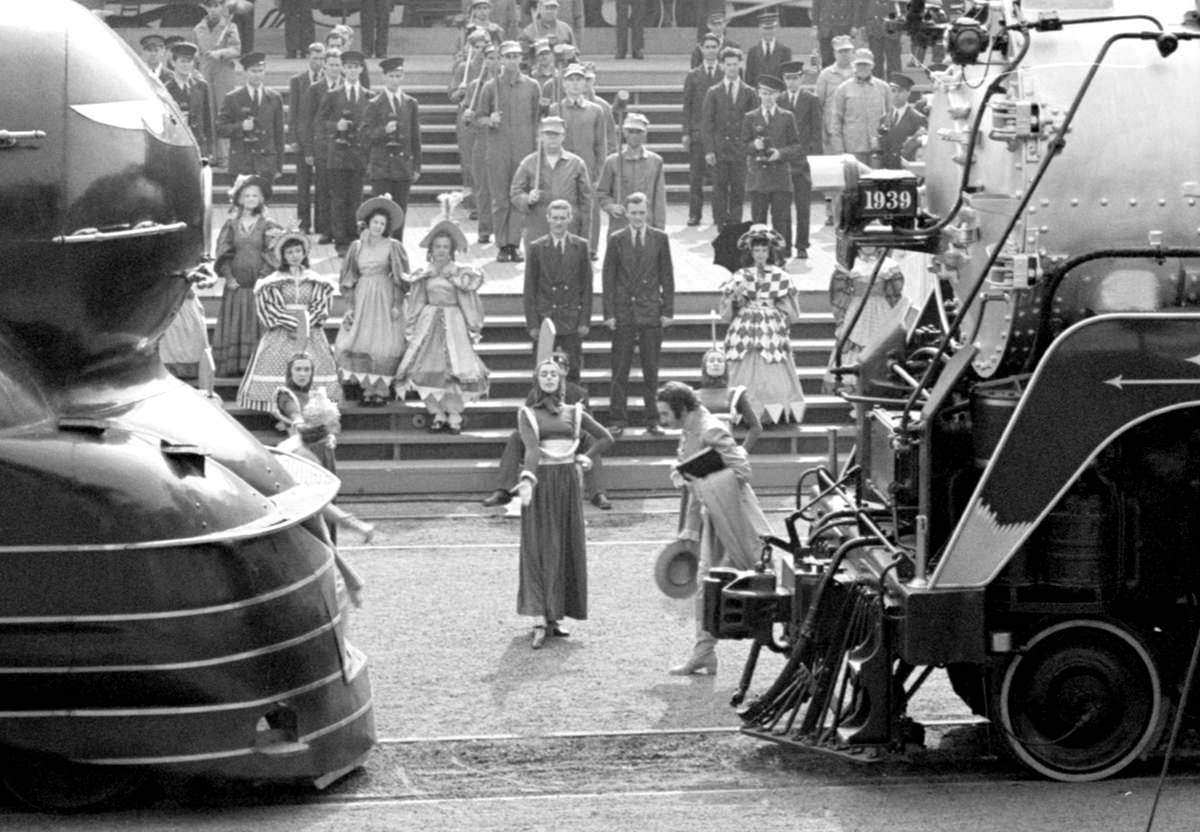 A closer view of the end of the railroad pageant, as a "woman of the future", center, brings together performers representing past and present, on May 27, 1939.