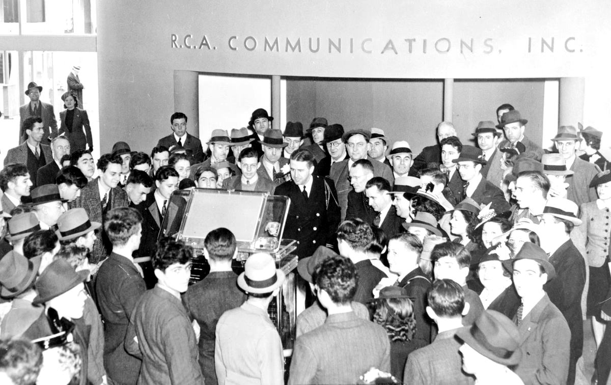 Crowds surround a new television in the RCA exhibit at the 1939 World's Fair.