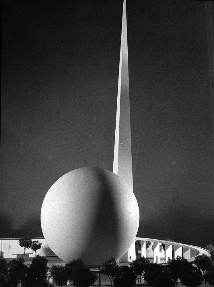 Modernist symbols of the 1939 World’s Fair, the Trylon and the Perisphere— collectively called the “Theme Centre” of the expo.