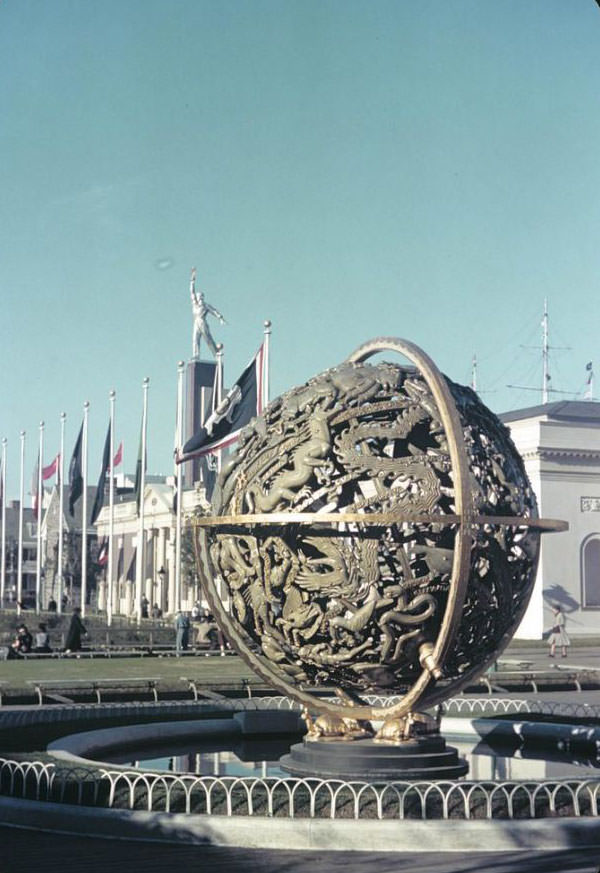 Globe along the Court of States, in front of the West Virginia and Georgia buildings with tower of the USSR (Soviet) Pavilion above, 1939 New York World's Fair