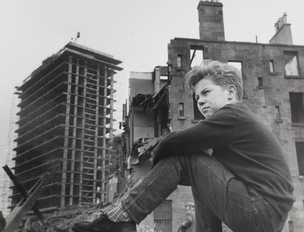 Eleven years old Gorbals boy Willie Thomason still comes back to his old territory among the old tenements and watches the progress being made by workmen.