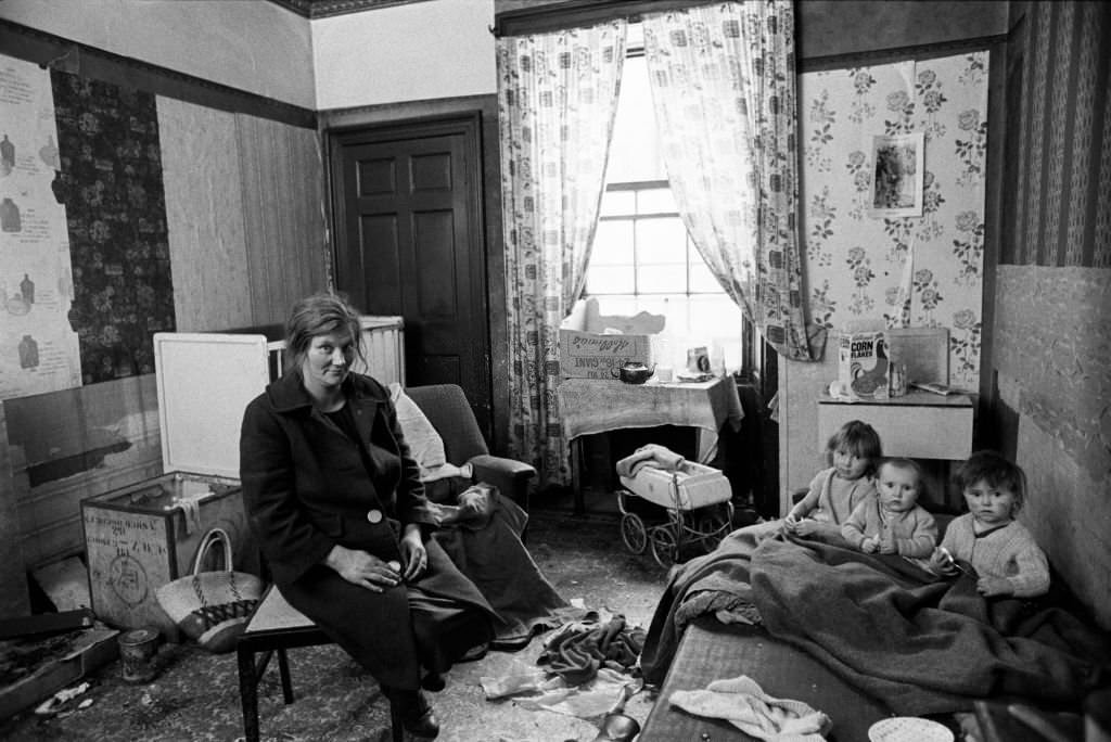 A mother and three little children in the interior of their flat in the notorious Gorbals district of Glasgow, 1969