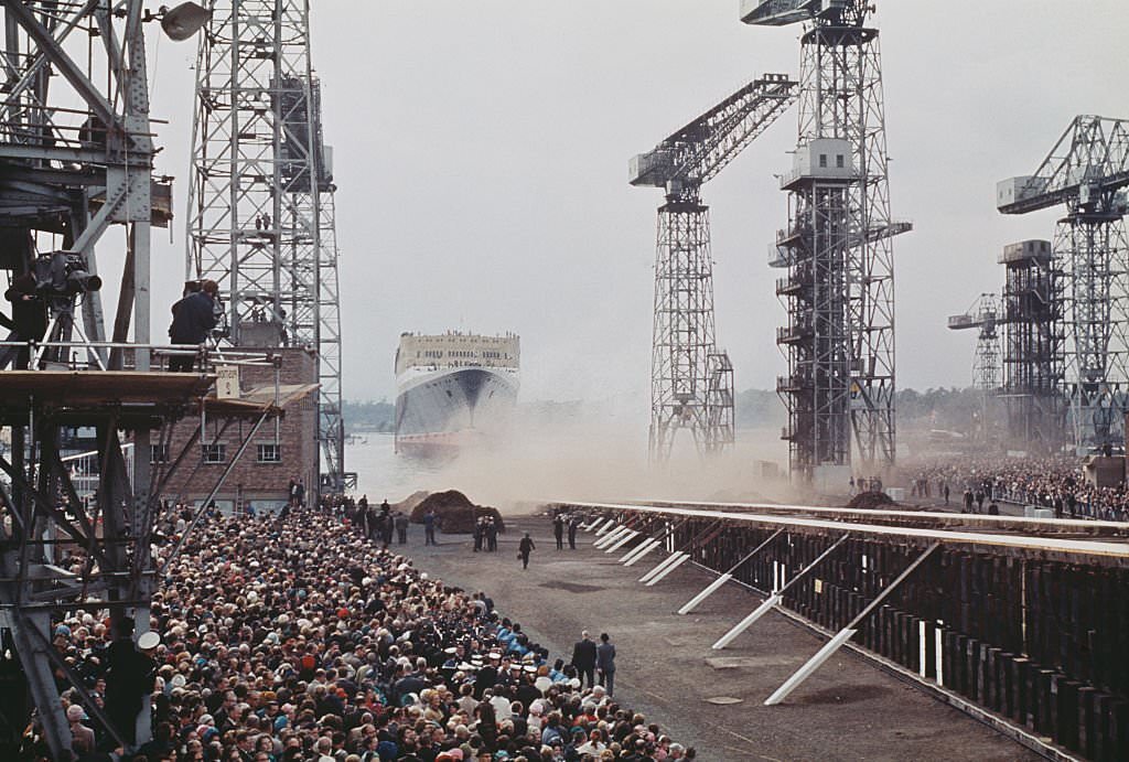 View of the ocean liner Queen Elizabeth 2, owned by Cunard, being launched down the slipway at John Brown shipyard in Clydebank near Glasgow in Scotland on 20th September 1967.