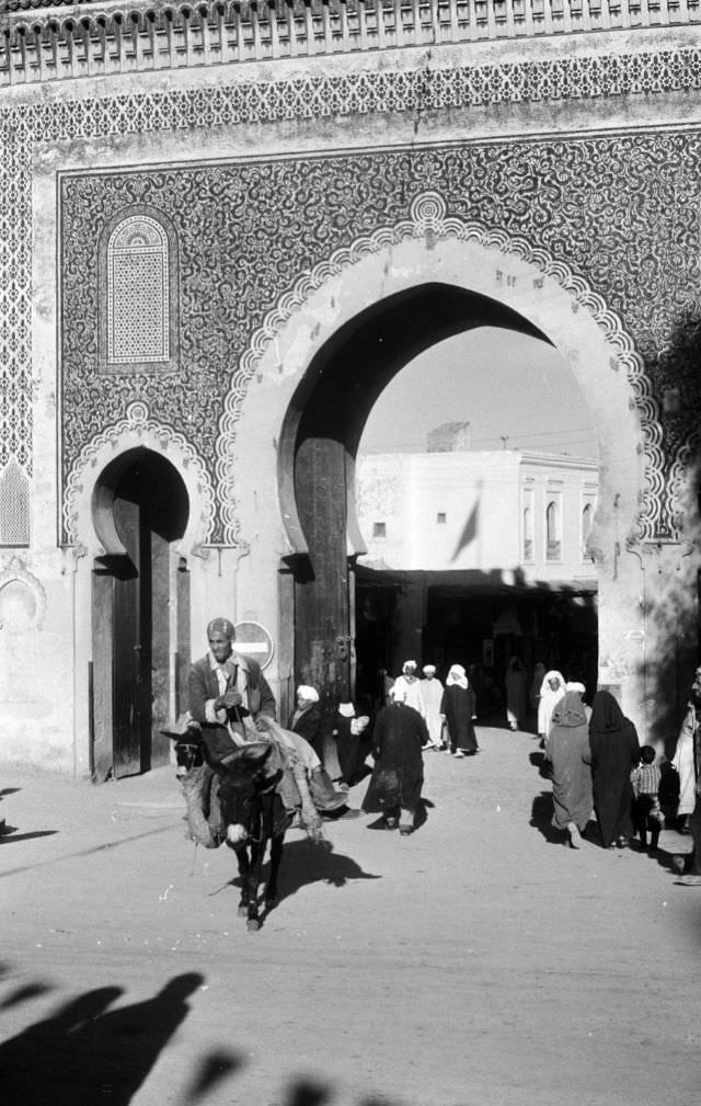 Man riding mule through Blue Gate in Fez, 1960s
