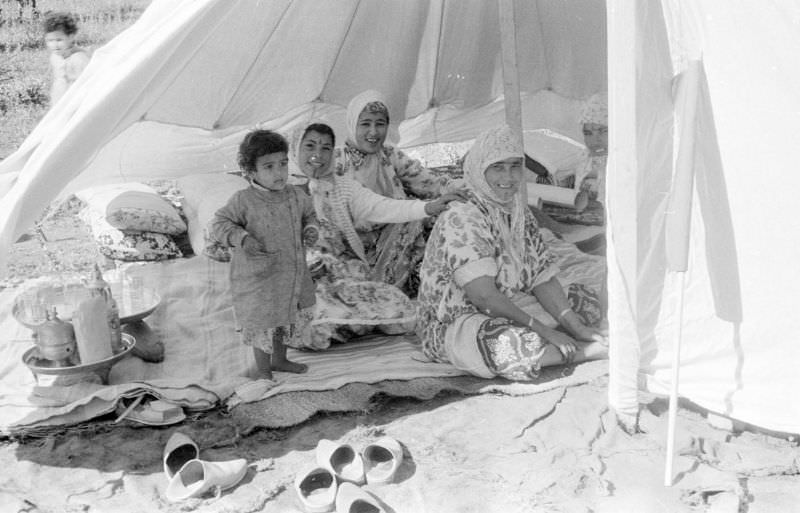 Berber women and child inside tent at camp, 1960s