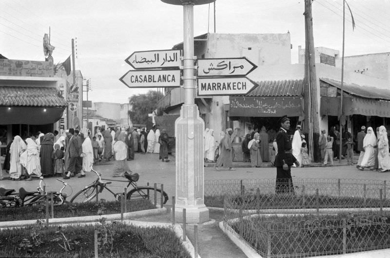 Directional sign in intersection pointing to Casablanca and Marrakech, 1960s