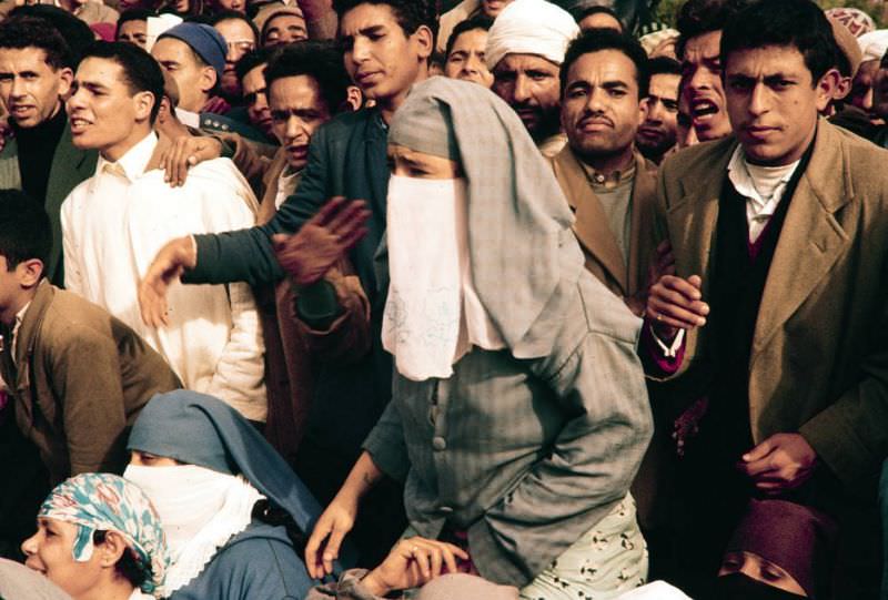 Spectators at event, 1960s